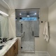 Frameless Shower Door Enclosure and Vanity Mirror in Denville, NJ
